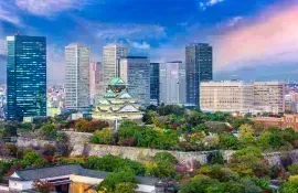 Osaka castle, surrounded by city business center skycrapers