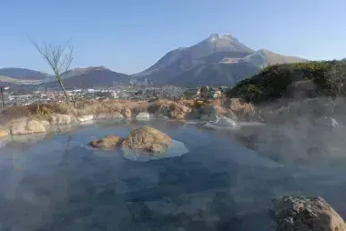 Steam rising from an outdoor onsen in Yufin 