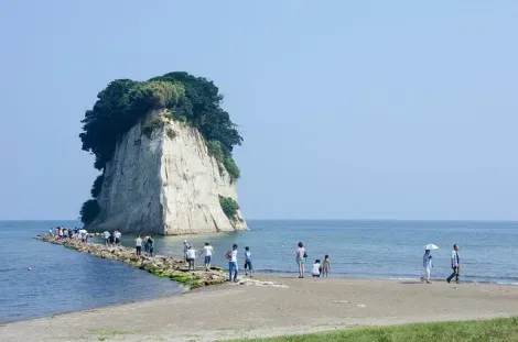 A small pebble path leads to the island of Mitsukejima