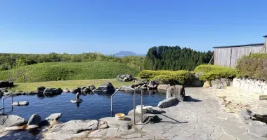 Outdoor swimming pool with a view of Mount Aso