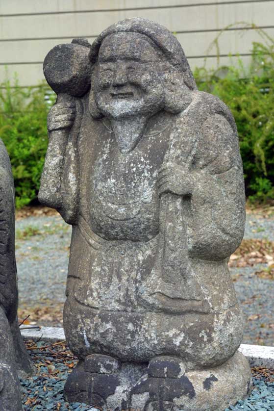 A stone carved Daikoku.