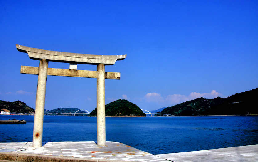 Torii of Sumiyoshi Shrine in Mitarai with the last two bridges leading over to Okamurajima in the background.