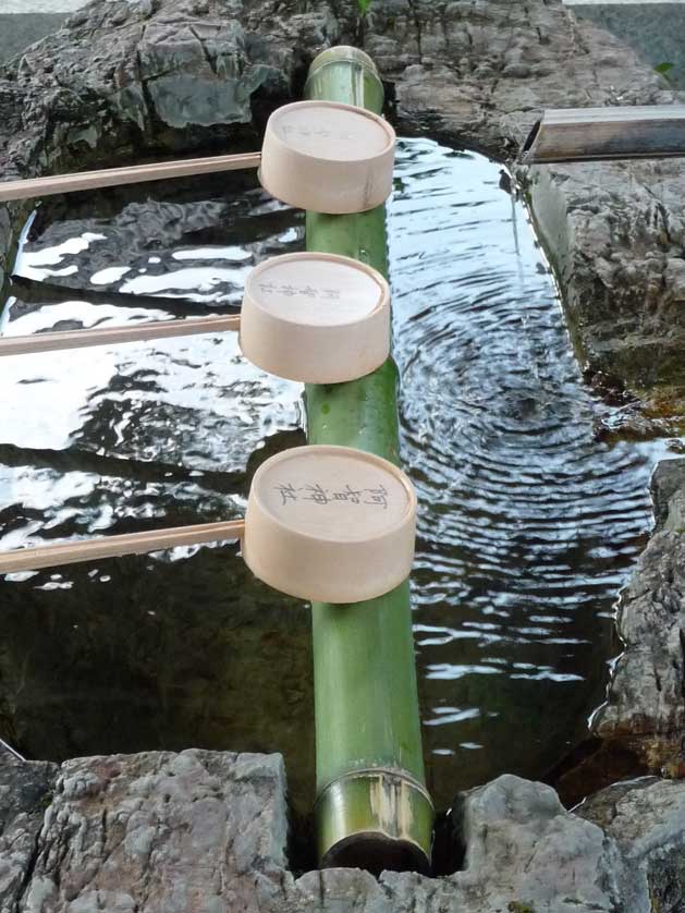 Bamboo water dippers at a Japanese shrine.