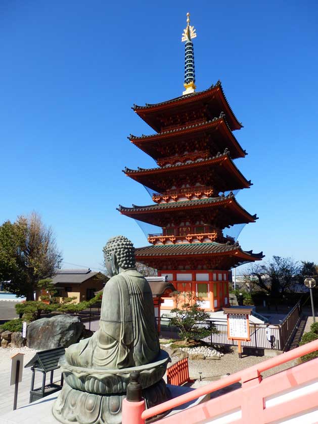 Pagoda and stone Buddha at  Iinuma Kannon Temple, Choshi, Chiba Prefecture