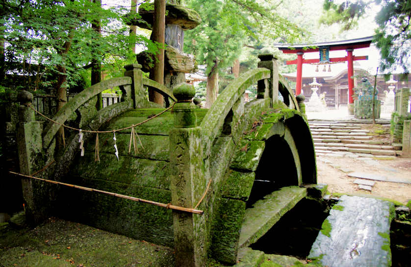 Unusual curved bridge at Ichinomiya Shrine.
