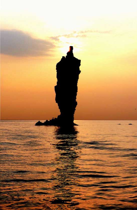 Candle Rock at sunset, the icon of Dogo Island, Oki Islands.