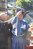 Dressing the sake man at Muroji Temple, Nara.