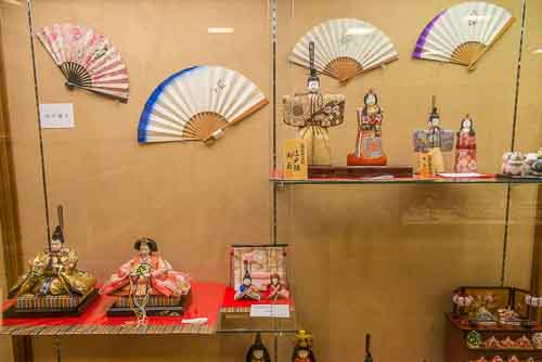 Japanese dolls and fans at the Edo Shitamachi Traditional Crafts Museum, Taito ward, Tokyo.