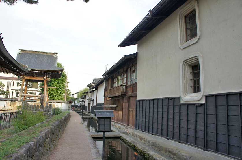 Carp channel behind a sake brewery, Gifu Prefecture.