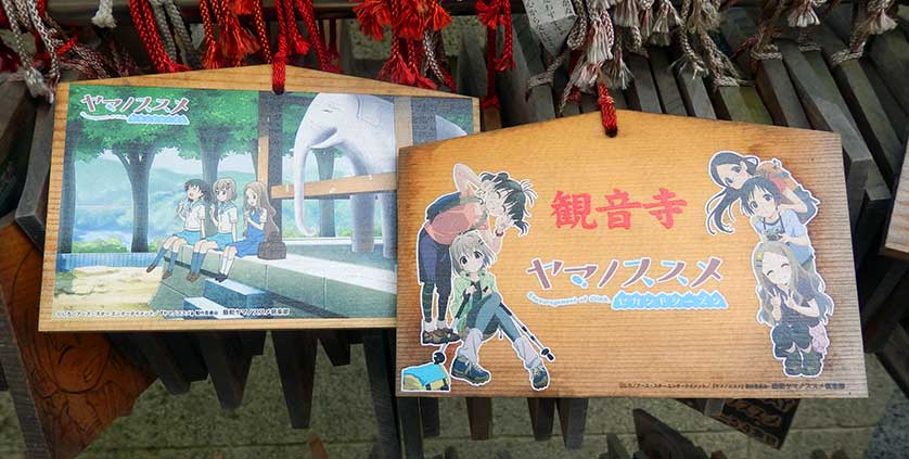 Ema plaques featuring manga characters at Kannon-ji Temple.