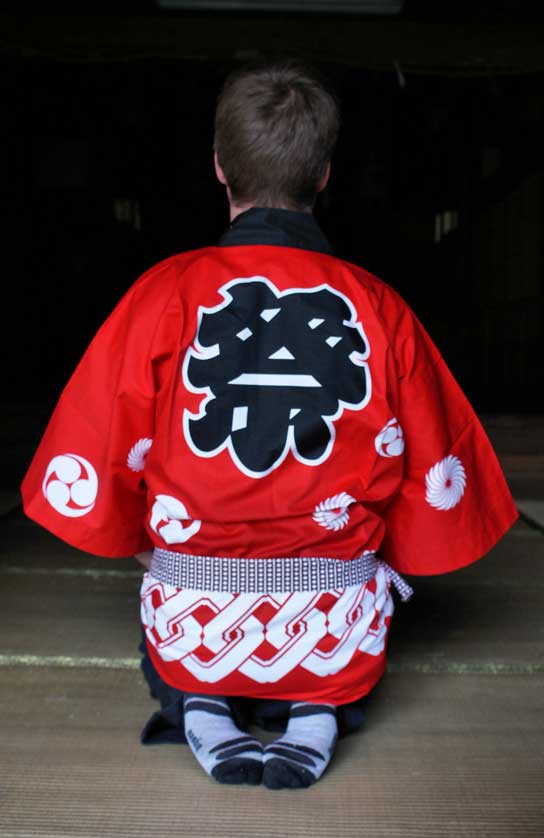 Red happi with matsuri kanji on the back.