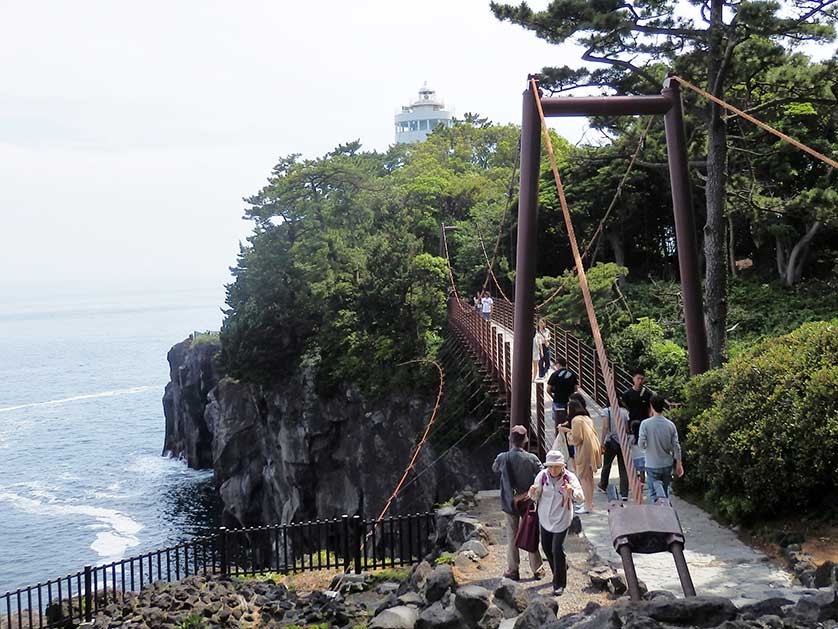 Kadowaki Suspension Bridge with Kadowaki Lighthouse in the background.