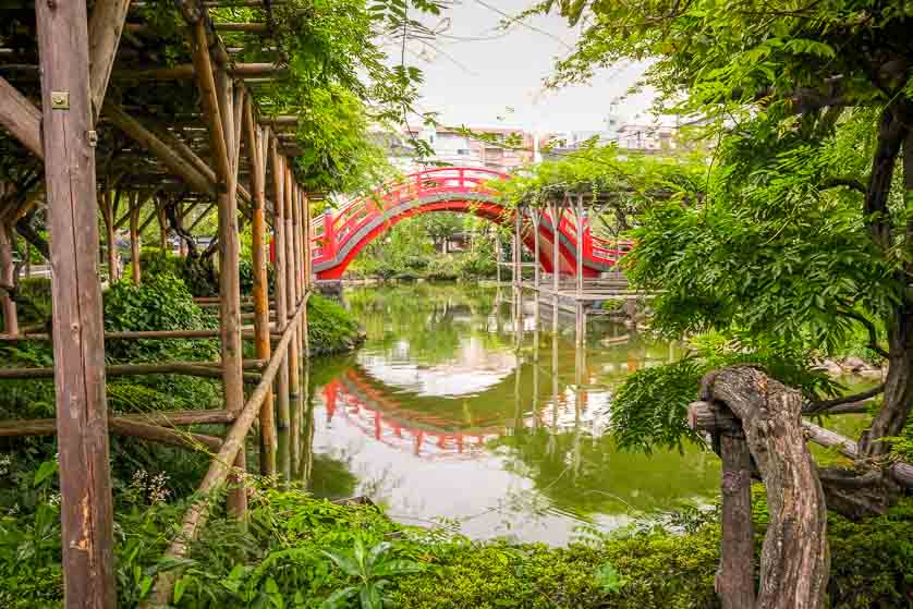 Pond and bridge  with wisteria, Kameido Tenjin, Tokyo.