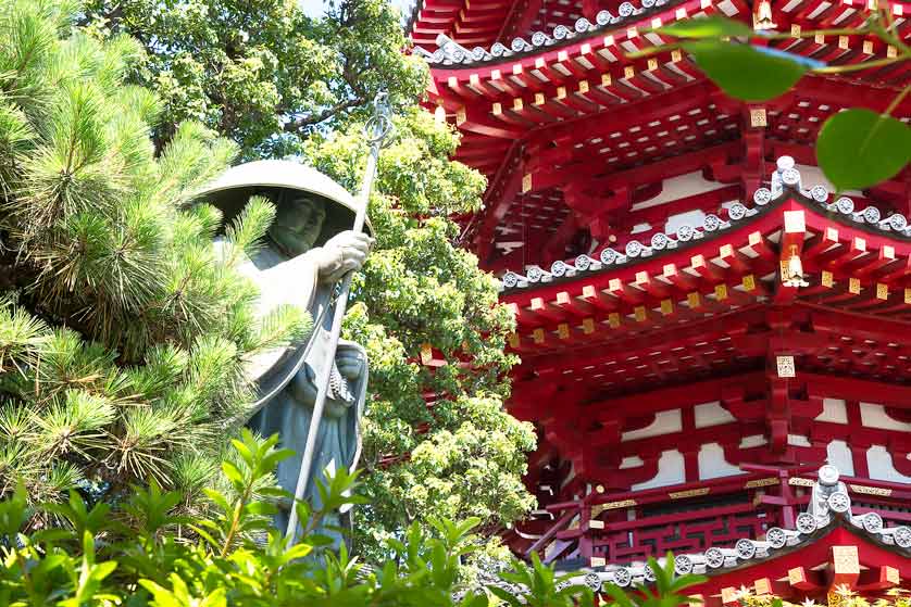 Statue of Kobo Daishi, with octagonal pagoda.