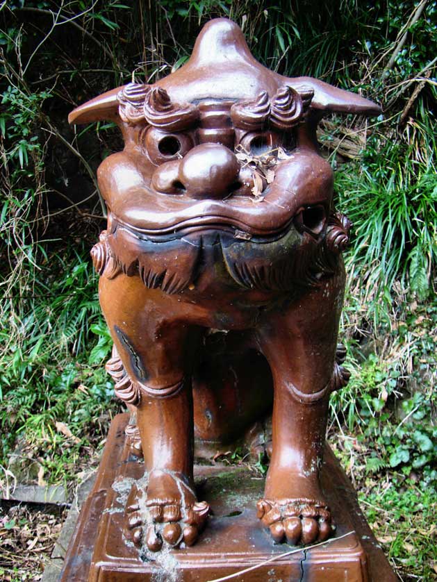 A ceramic komainu at an abandoned shrine in Hamada, Shimane.