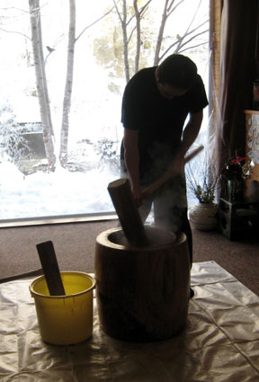 Pounding mochi rice cakes in Japan.