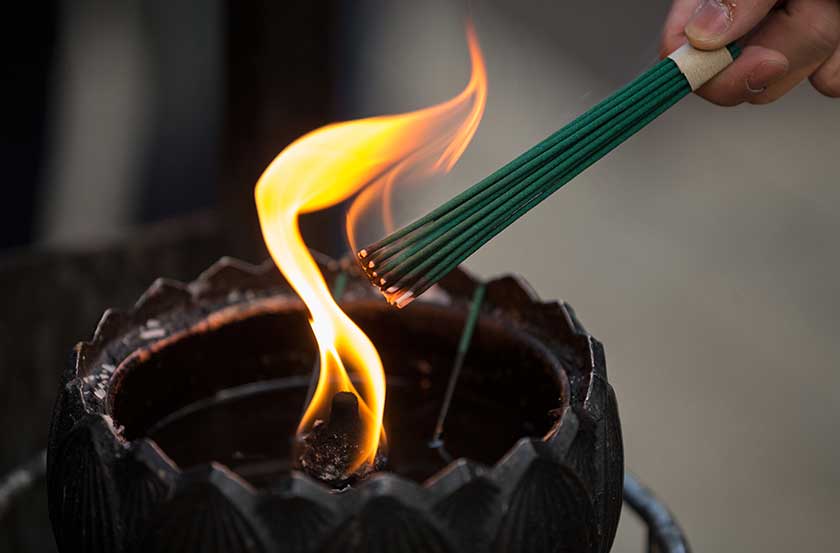 Offering incense at a temple on the Nakasendo.