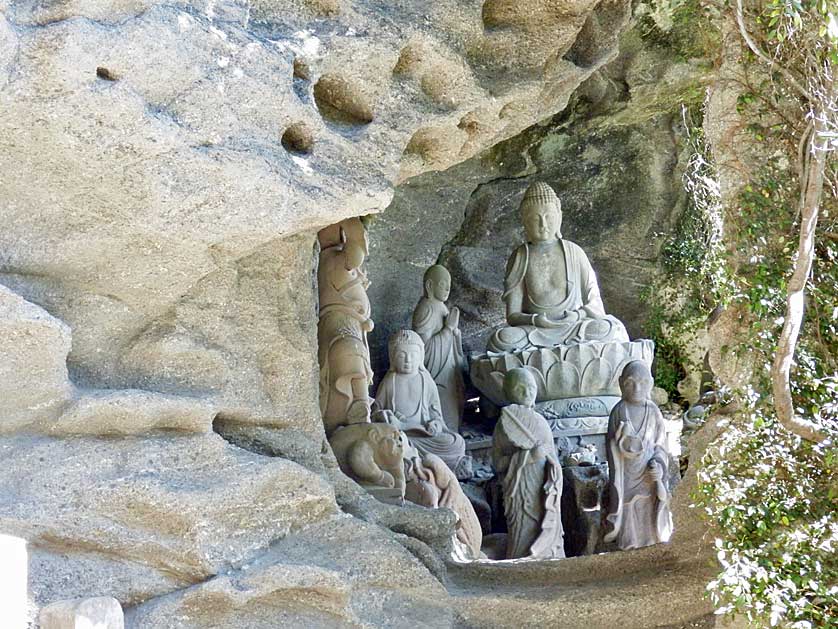 Group of rakan sculptures in a cave, Mount Nokogiri, Chiba Prefecture, Japan.