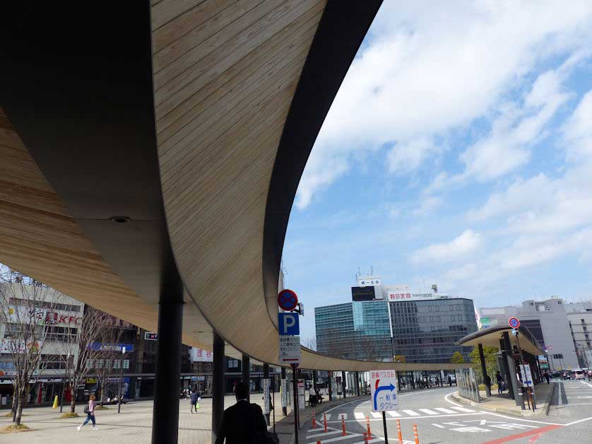Covered walkways lead from the north entrance of Oita Station to the main bus terminal.