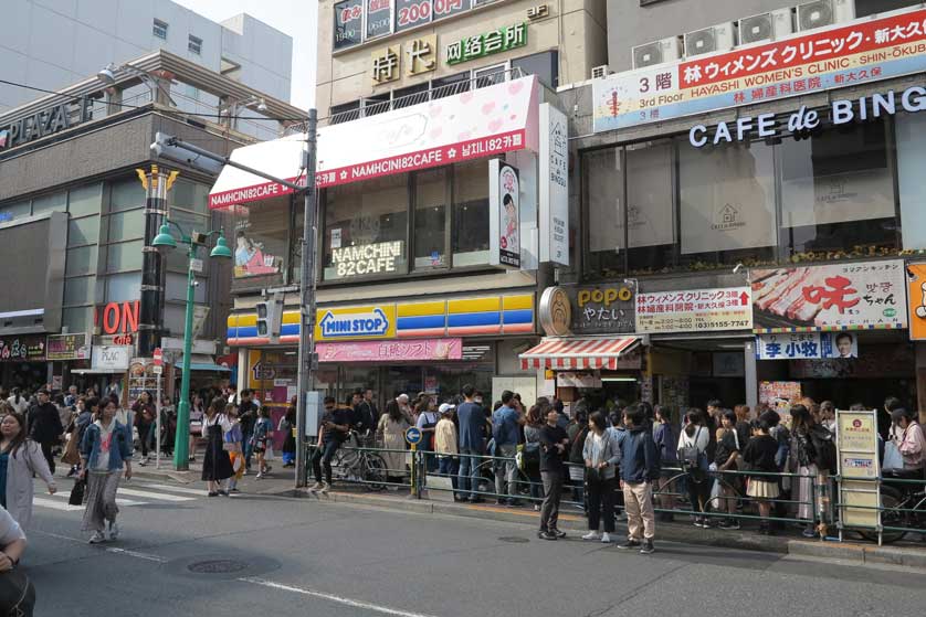 Crowds, Okubo, Tokyo, Japan.