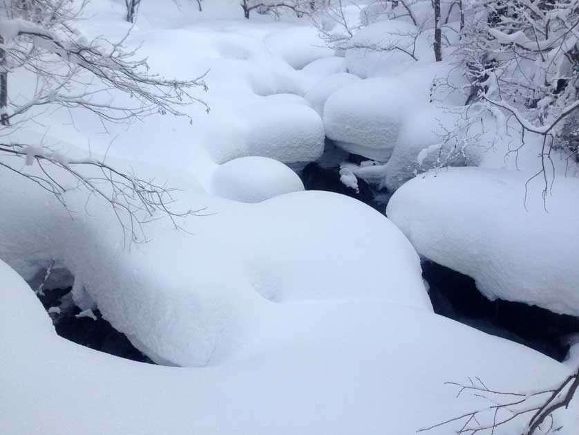 Pillowy Snowy River Banks, Hokkaido, Japan