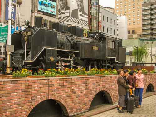 Steam locomotive outside Shimbashi Station.