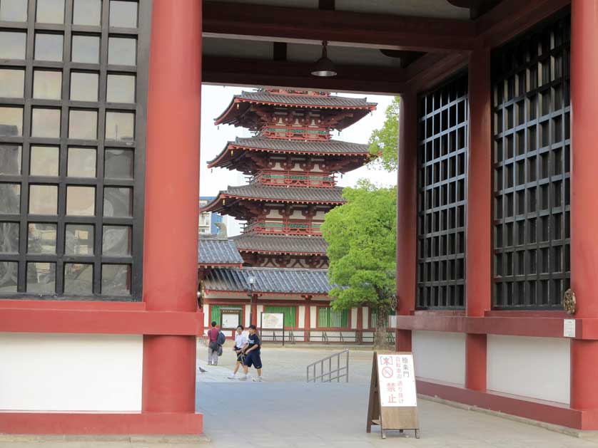 Temple pagoda seen through a temple gate, Tennoji district, Osaka.