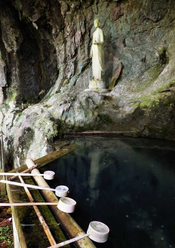 The sacred spring and statue representing the Summer Solstice Kannon at Dounzan on Shodoshima.