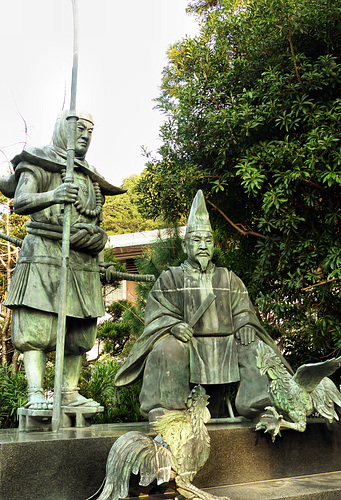 Statue of Benkei & his father with fighting cocks at Tokei Shrine.