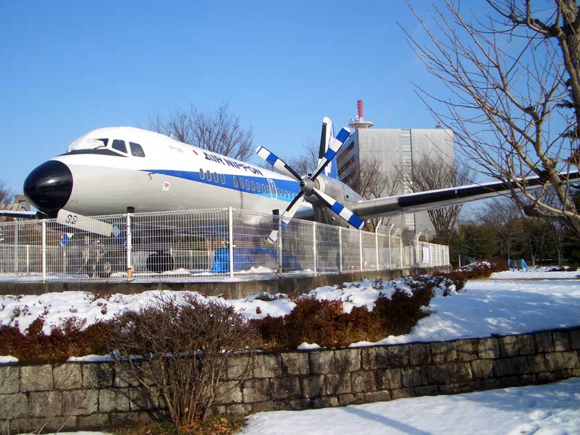 Vintage airplane parked in front of Kokukoen Station, Tokorozawa, Saitama Prefecture, Japan.