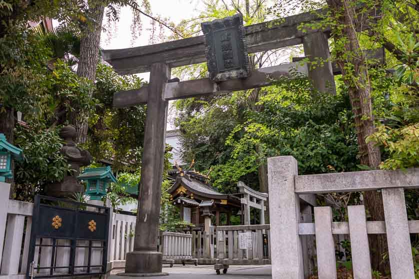 Stone torii gate at side entrance of Torigoe Shrine, Taito-ku, Tokyo.