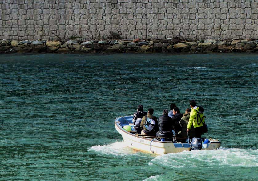 The ferry that connects Genbudo Station with Genbudo Cave.