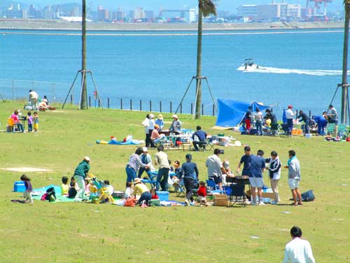 Picnicking in Uminonakamichi Seaside Park by Hakata Bay, Fukuoka City, Fukuoka Prefecture, Japan.