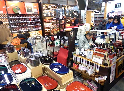 Wajima lacquerware shop with lacquer artist at work, Ishikawa.