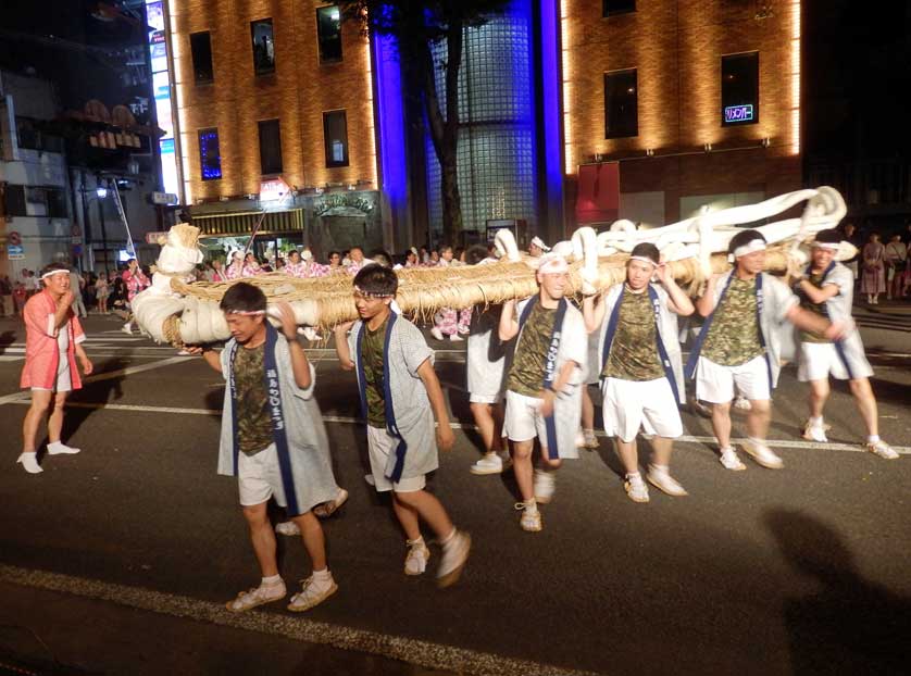 Boys fooling around with a waraji sandal, Fukushima.