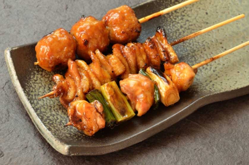 Japanese yakitori grilled chicken on a skewer.