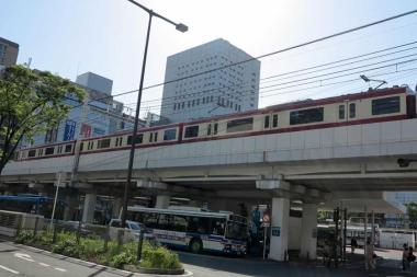 Keikyu Line Train running past Kawasaki Station, Kanagawa, Japan.