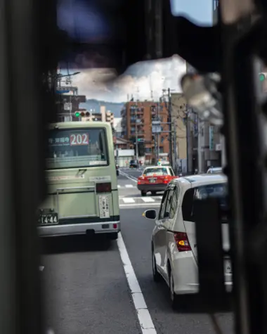 View on the road from inside a bus in Kyoto