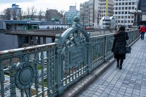 Yotsuya-mitsume Bridge, with Akasaka Exit of Yotsuya Station in background Yotsuya-mitsume Bridge, with Akasaka Exit of Yotsuya Station in background