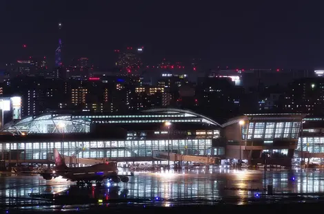 Fukuoka Airport International Terminal at night with Fukuoka City in the background
