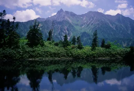 Mont Yarigatake is reflected in the crystal clear waters of the mountain lakes