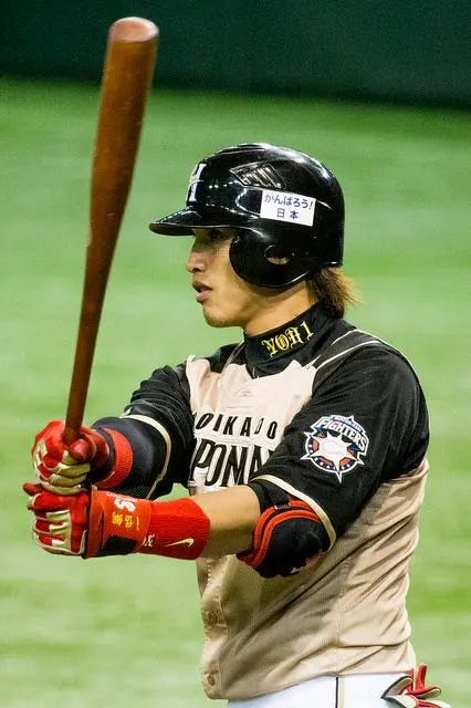 Le joueur Dai-Kang Yang de l'équipe Hokkaido Nippon Ham  Fighters, gagnante de la ligue pacifique en 2016