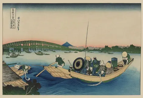 Coucher de soleil à travers le pont Ryōgoku sur la rivière Sumida à Onmayagashi. Coucher de soleil à travers le pont Ryōgoku sur la rivière Sumida à Onmayagashi.