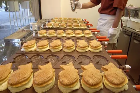 Confection de taiyaki dans leurs moules Confection de taiyaki dans leurs moules