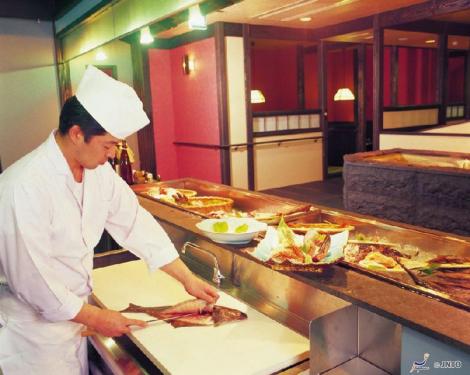 A chef preparing sashimi inn Shiretoko Grand Hotel, Hokkaido