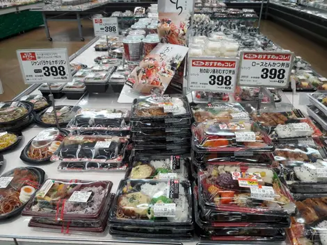 stall selling fresh cooked food 'bento box' Supermarket stall