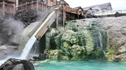 Water pouring into a outdoor cooling pool in Kasatsu Onsen