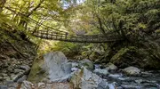 A rope bridge over a river in Iya Valley