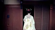 Geisha à l'entrée d'une maison de thé dans le quartier de Gion, à Kyoto