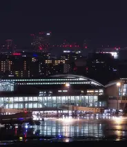 Fukuoka Airport International Terminal at night with Fukuoka City in the background